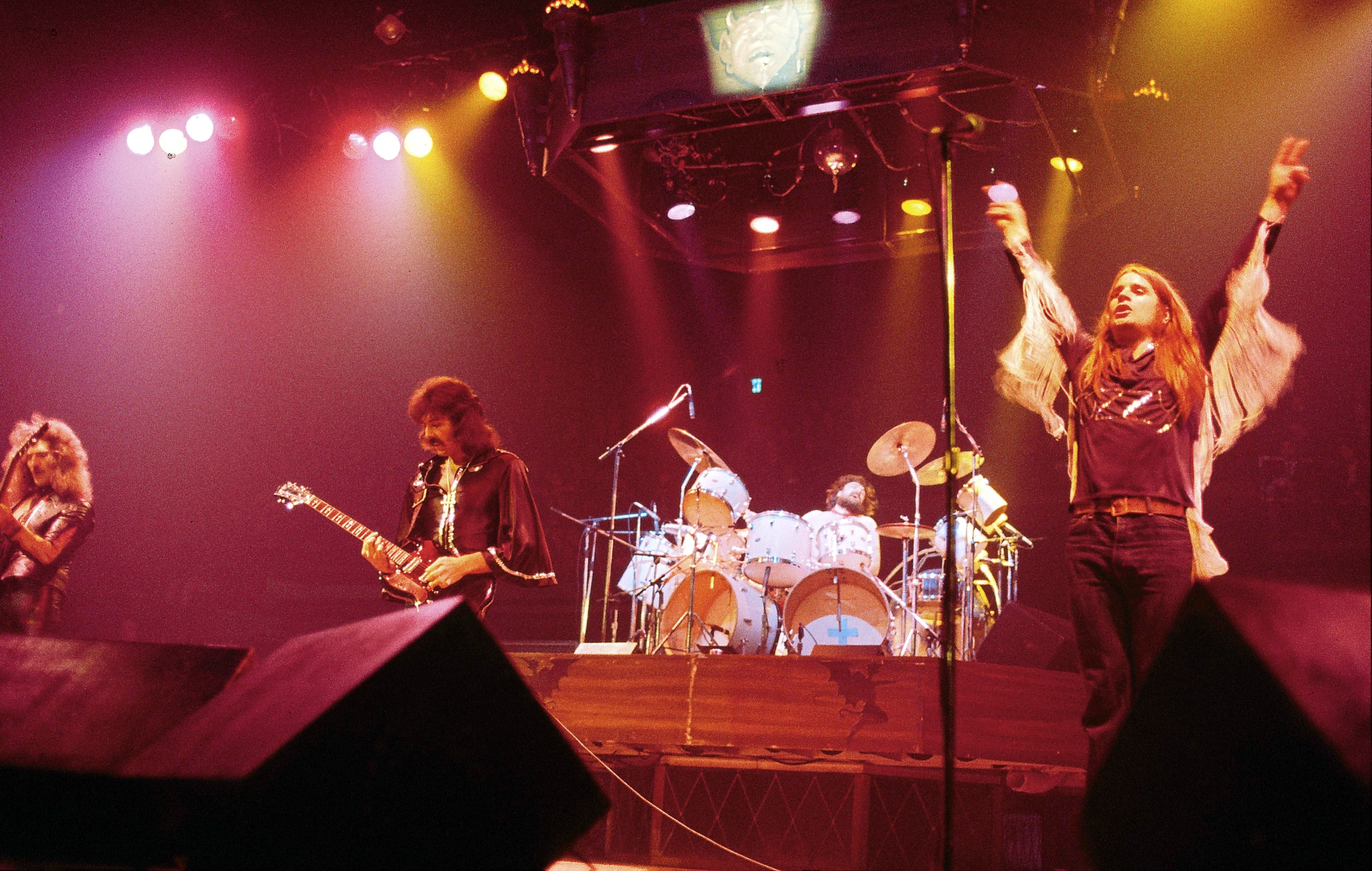 Geezer Butler, Tony Iommi, Bill Ward and Ozzy Osbourne performing live onstage