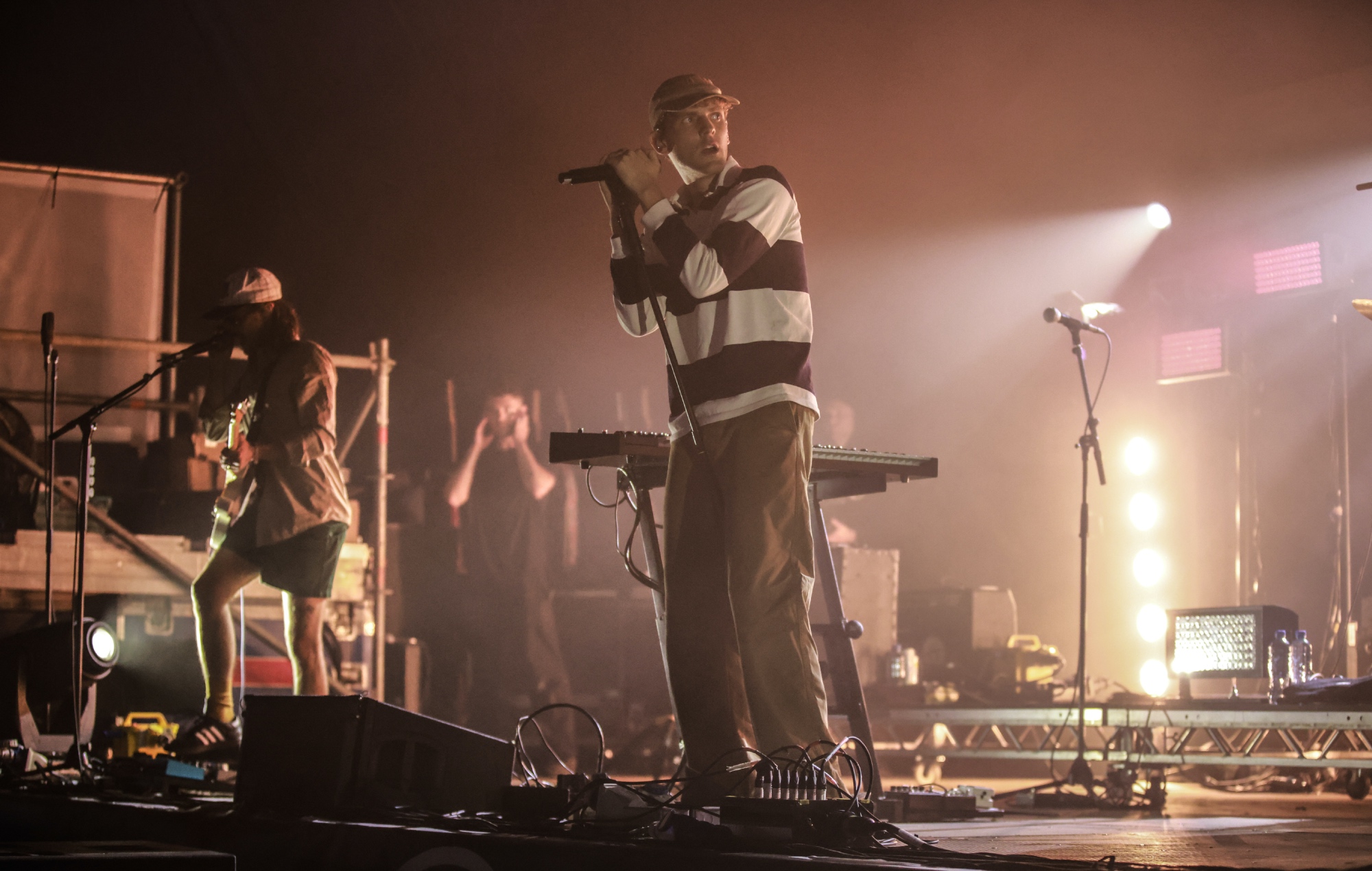 Coin performing live on stage