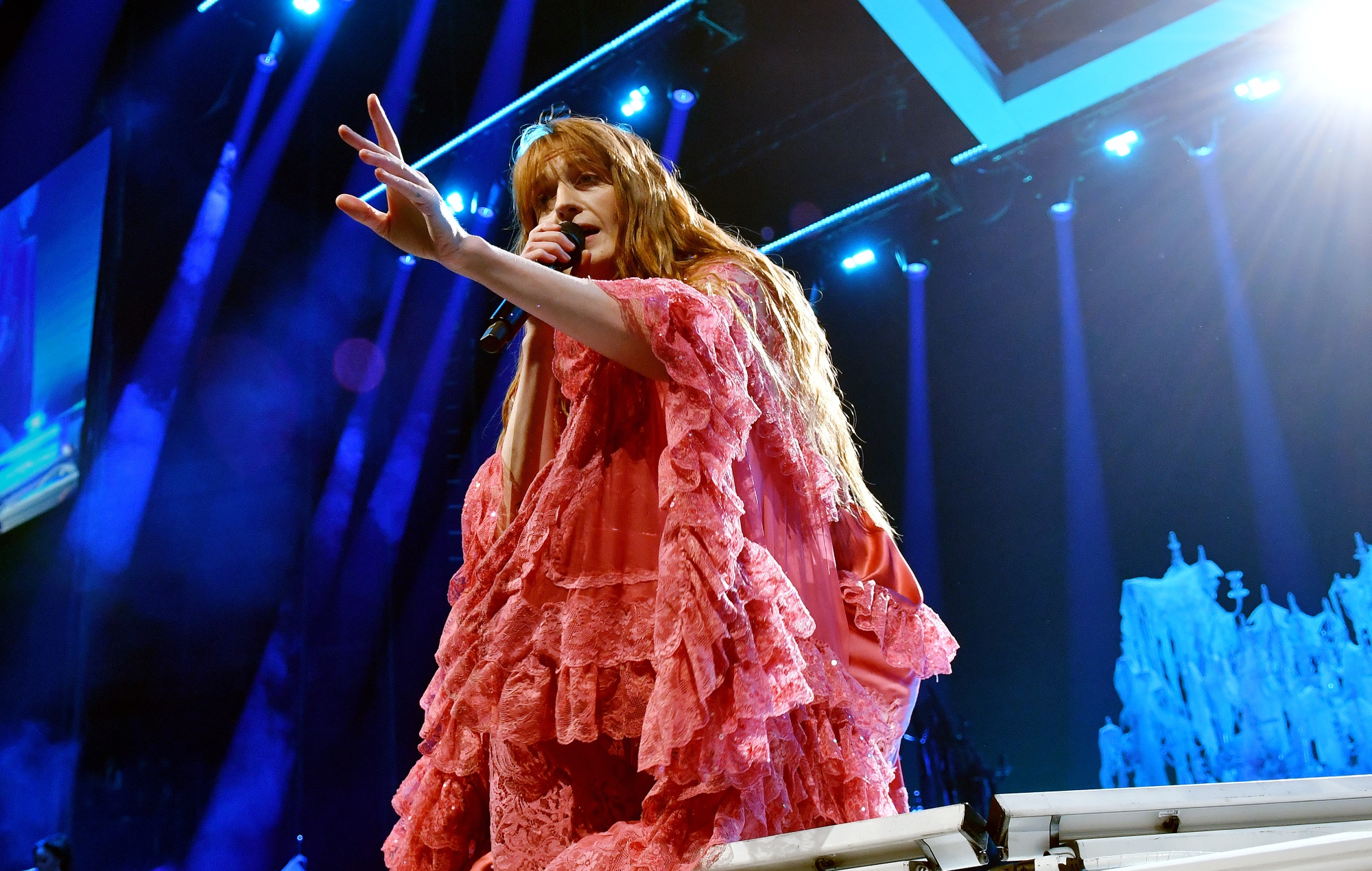 Florence Welch performing live on stage with Florence + The Machine, photo by Jim Dyson/Getty