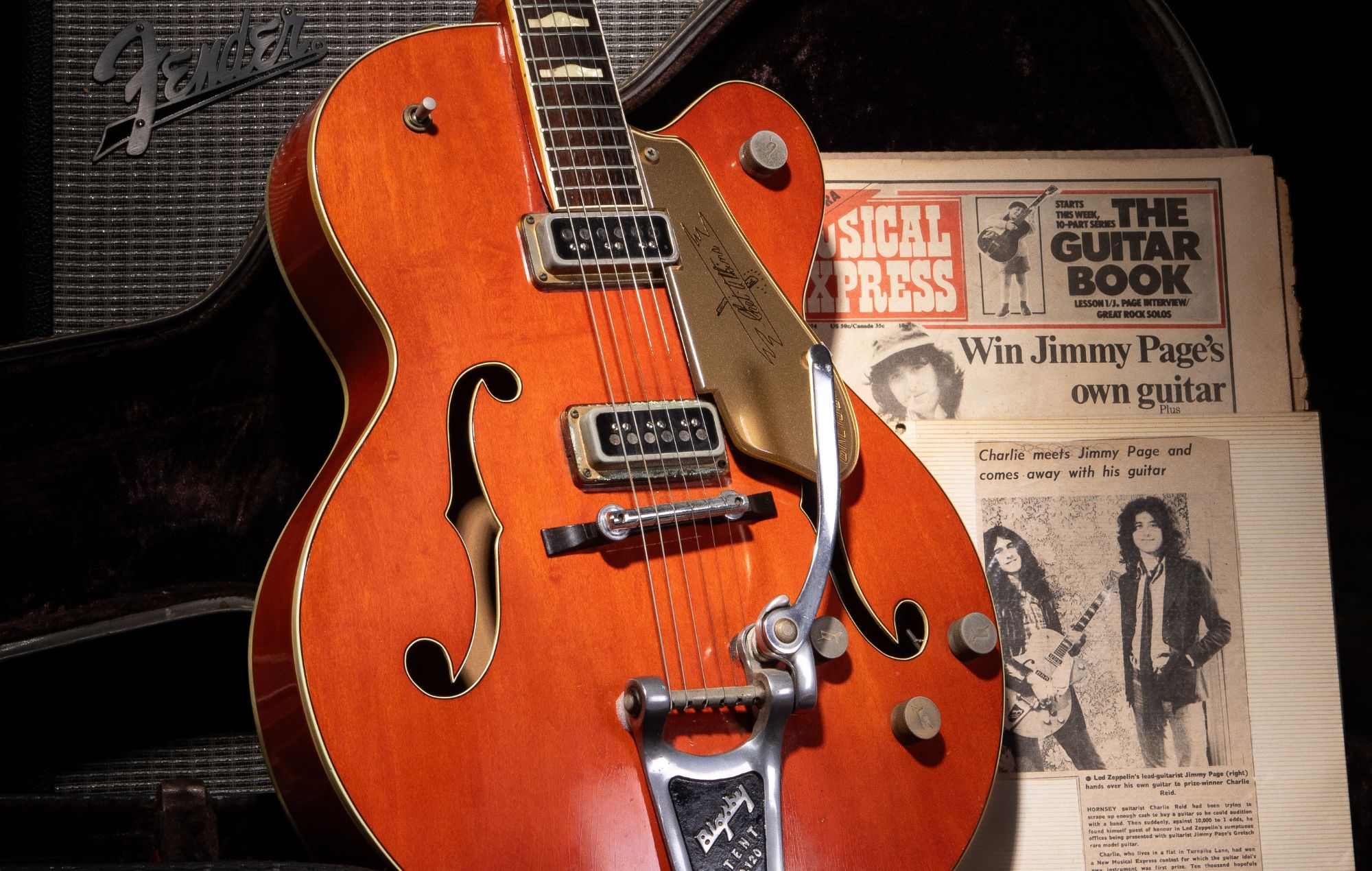 Jimmy Page's guitar going up for auction and copy of the New Musical Express. CREDIT: GARDINER HOULGATE – THE BATH AUCTION ROOMS