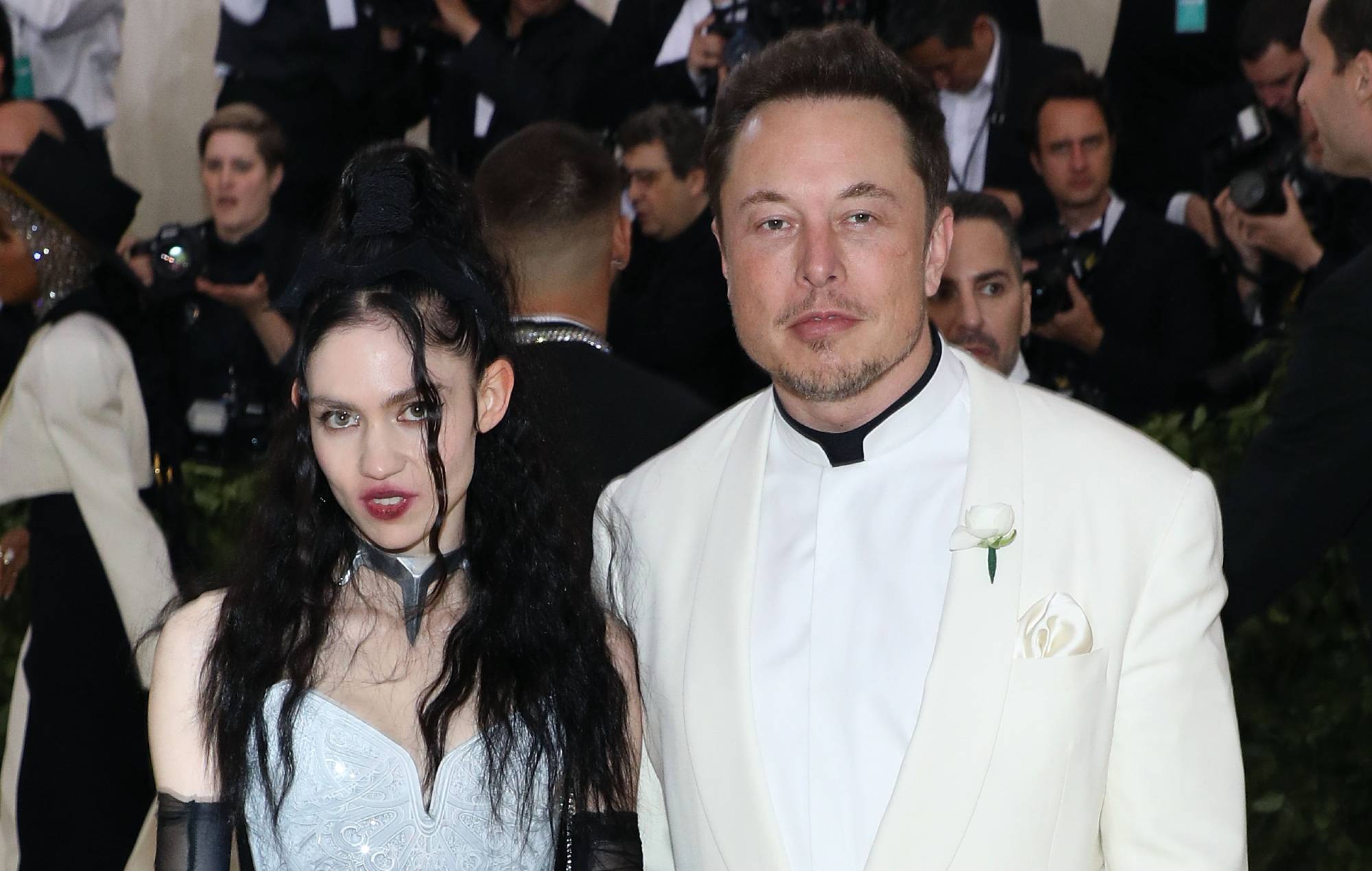 Grimes and Elon Musk attend "Heavenly Bodies: Fashion & the Catholic Imagination", the 2018 Costume Institute Benefit at Metropolitan Museum of Art on May 7, 2018 in New York City. Credit: Taylor Hill/Getty