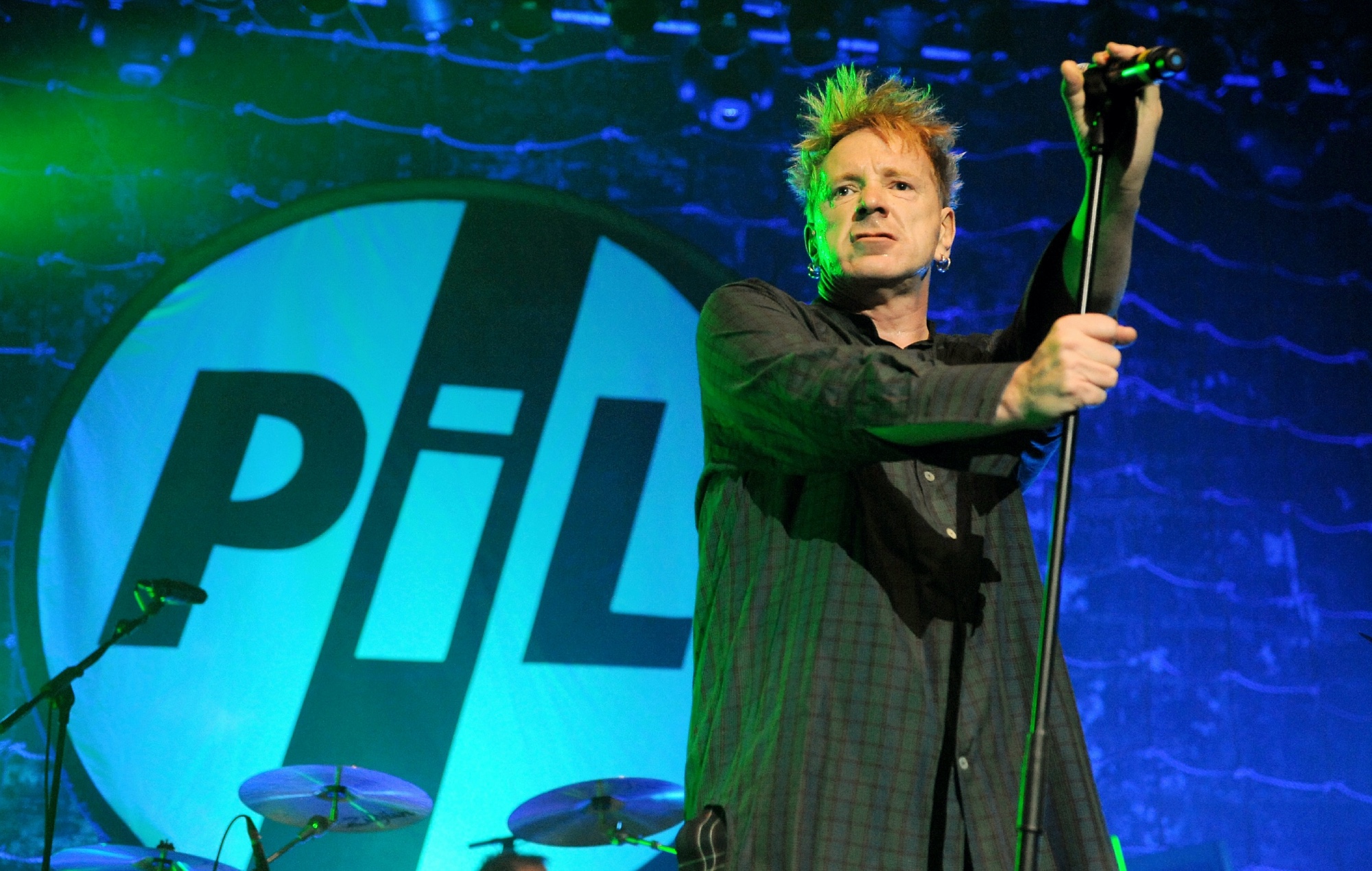 John Lydon performing live on stage with Public Image Ltd