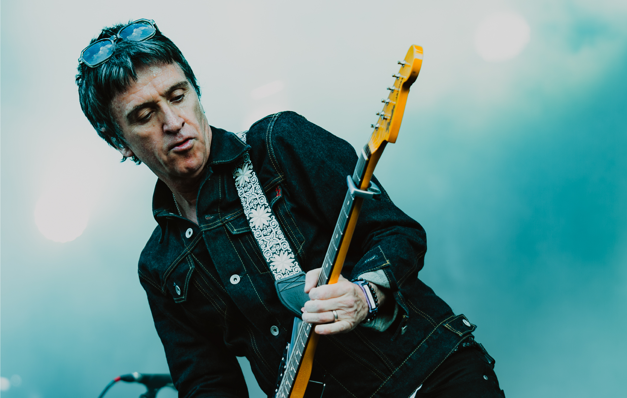 Johnny Marr performing live on stage, photo by Kristen Bourdeau/press