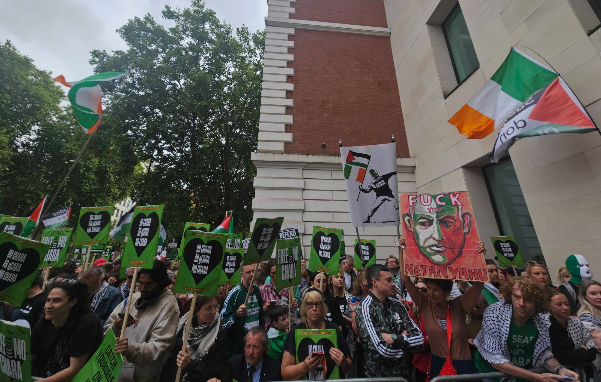 Crowds gather as Kneecap's Mo Chara appears in Court, August 20. CREDIT: NME