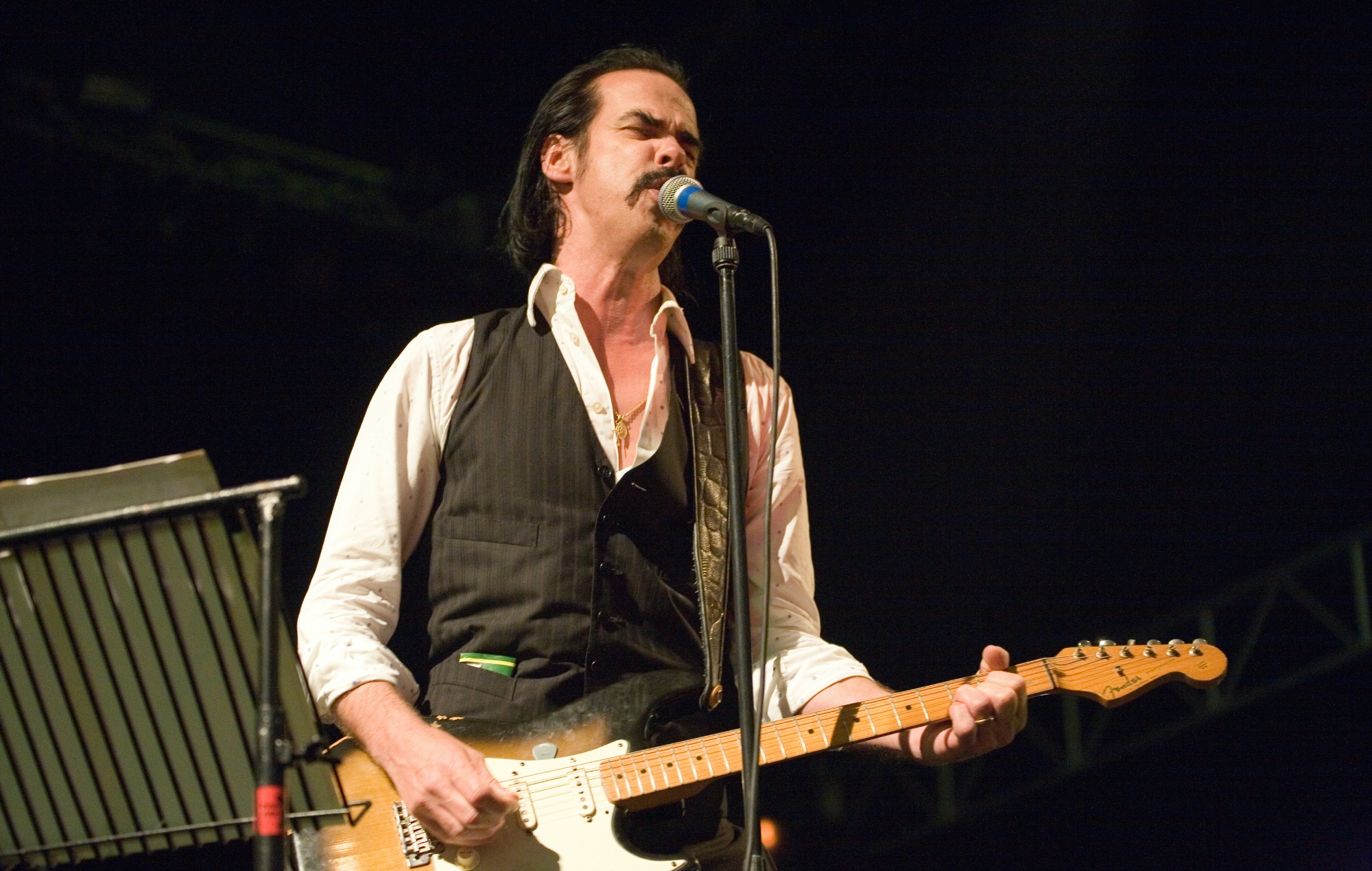 Nick Cave performing live on stage with Grinderman, photo by Edd Westmacott/Avalon/Getty