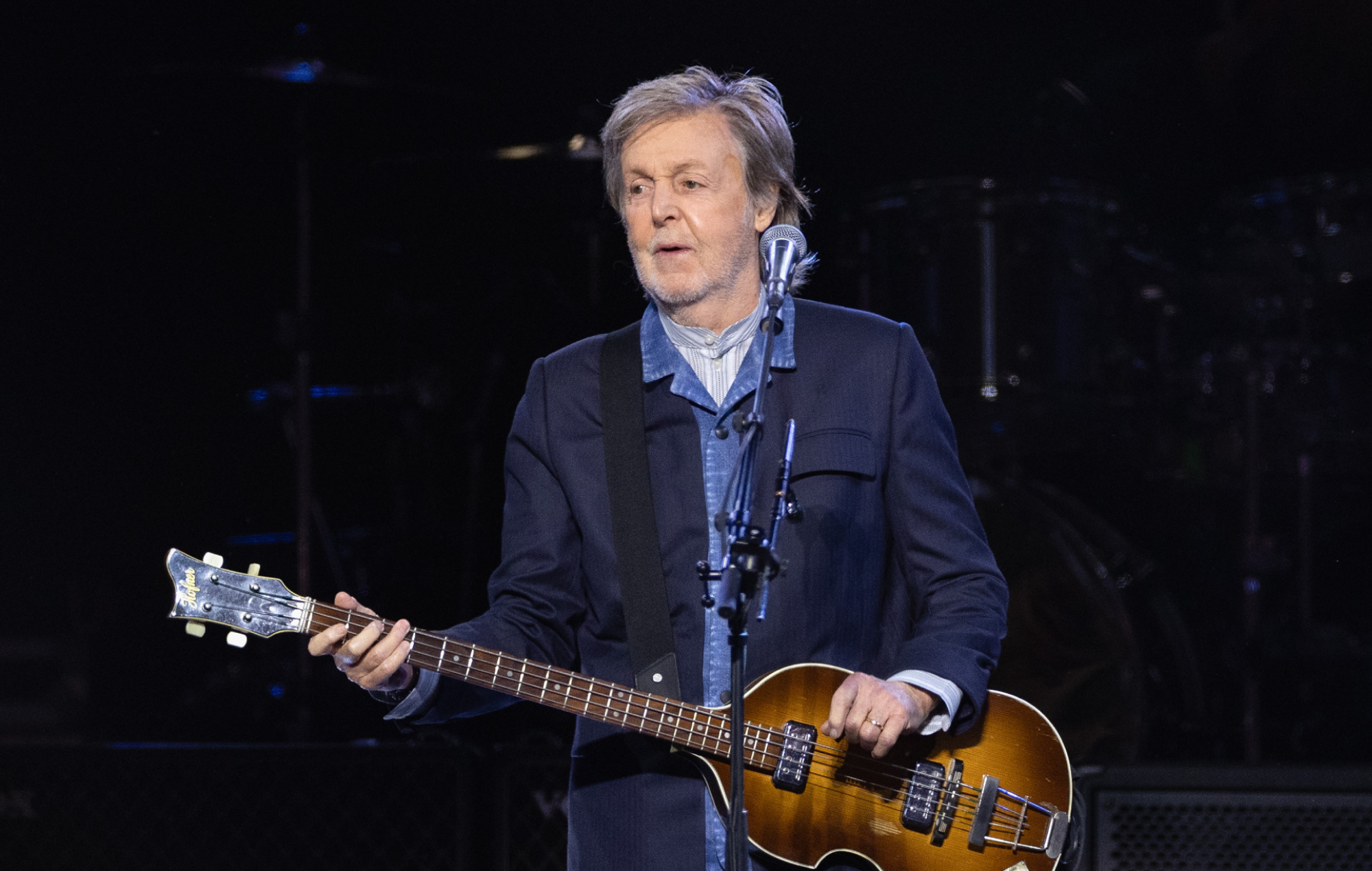 Paul McCartney performing live on stage