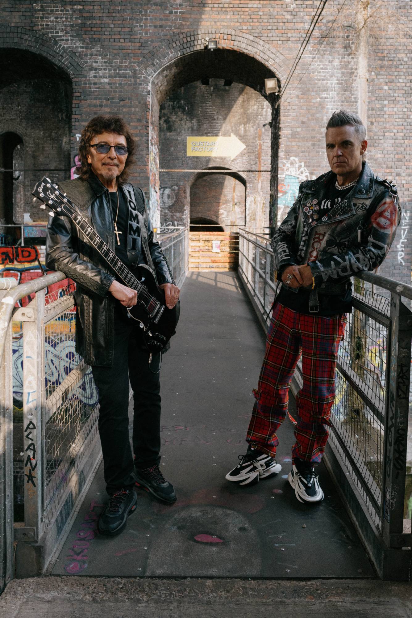 Tony Iommi and Robbie Williams. Credit: Leo Baron