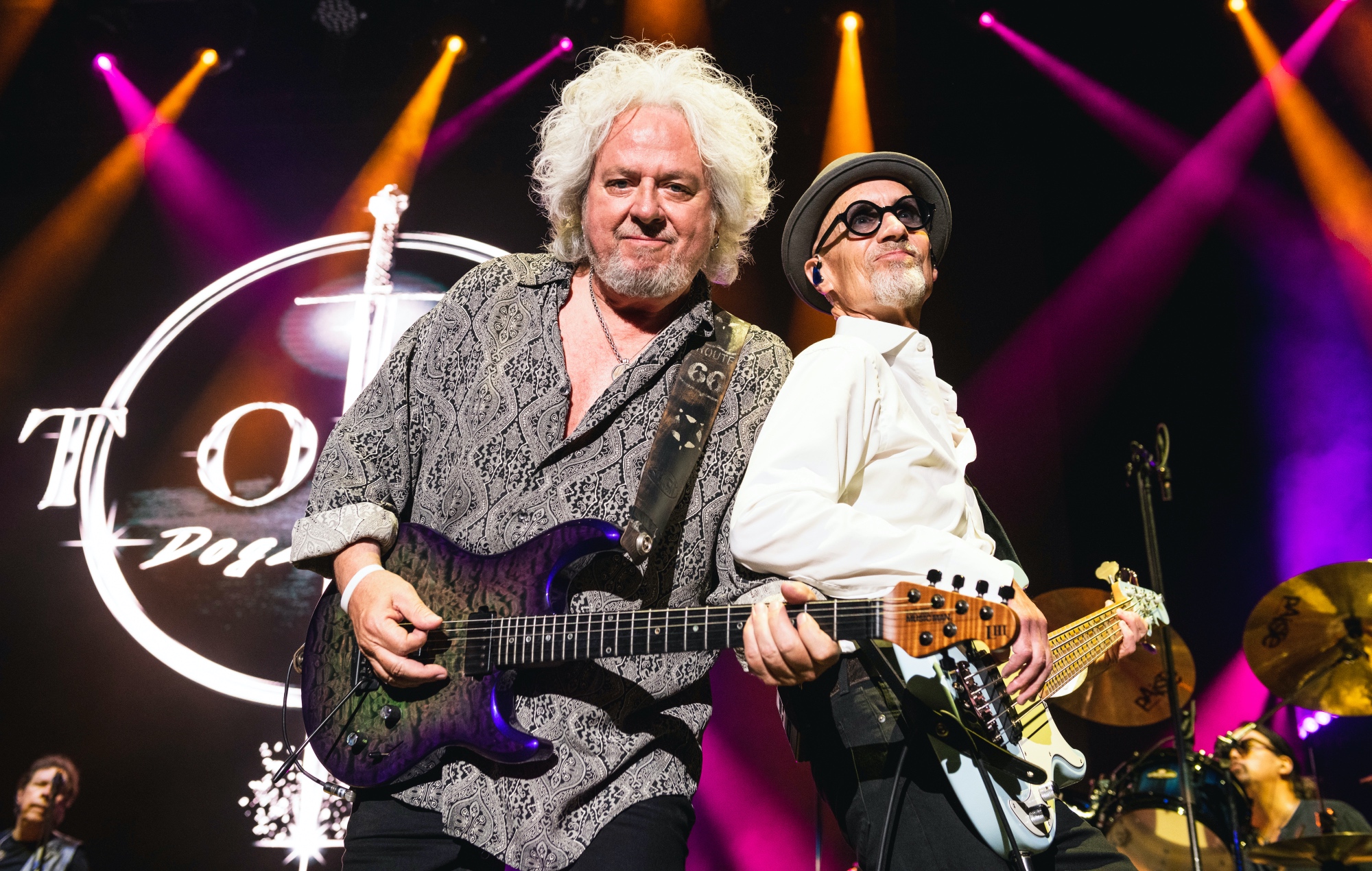 Steve Lukather and John Pierce performing live on stage with Toto