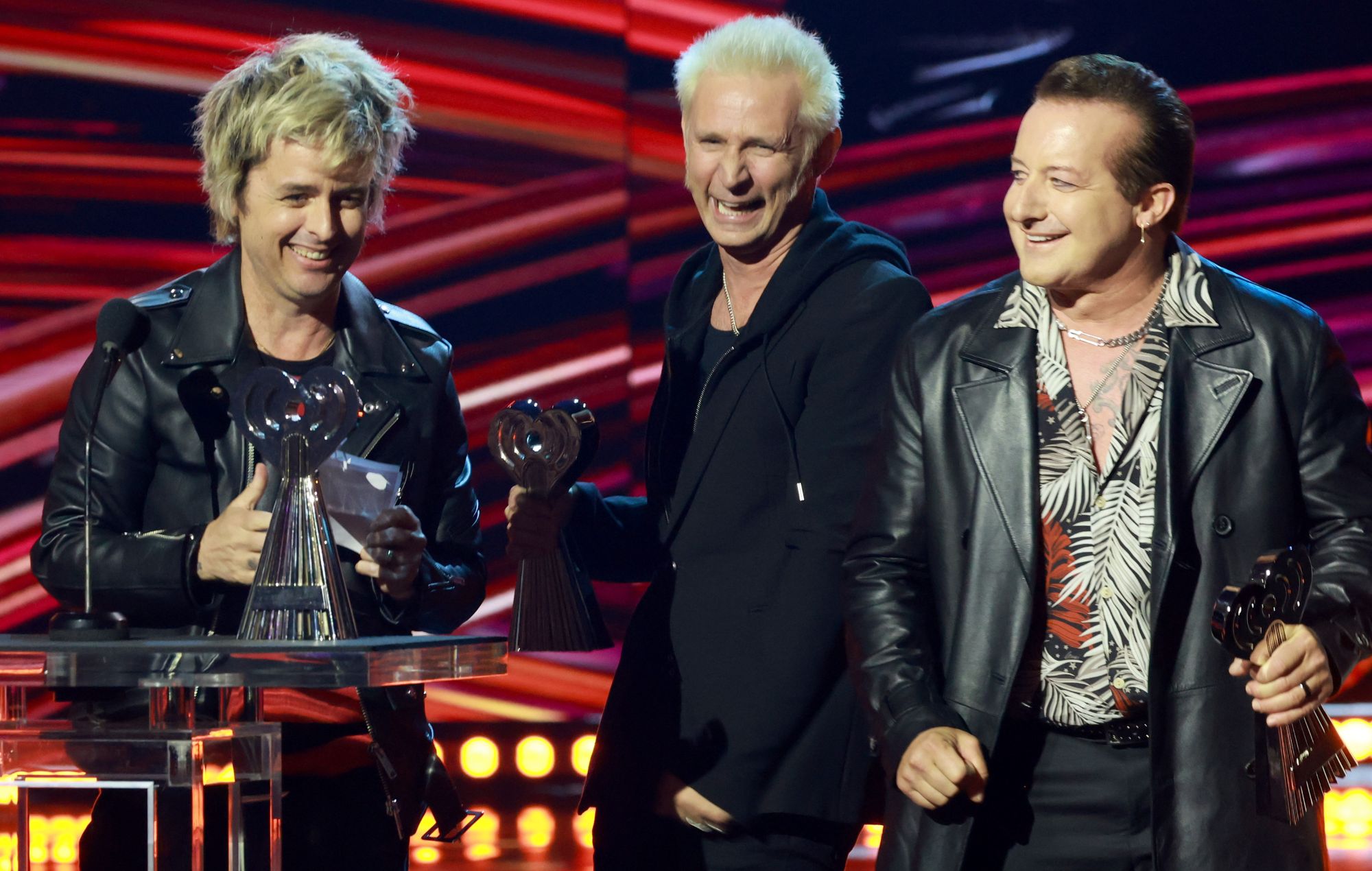 Billie Joe Armstrong, Mike Dirnt and Tré Cool of Green Day accept the Alternative Artist of the Year award onstage at the 2025 iHeartRadio Music Awards