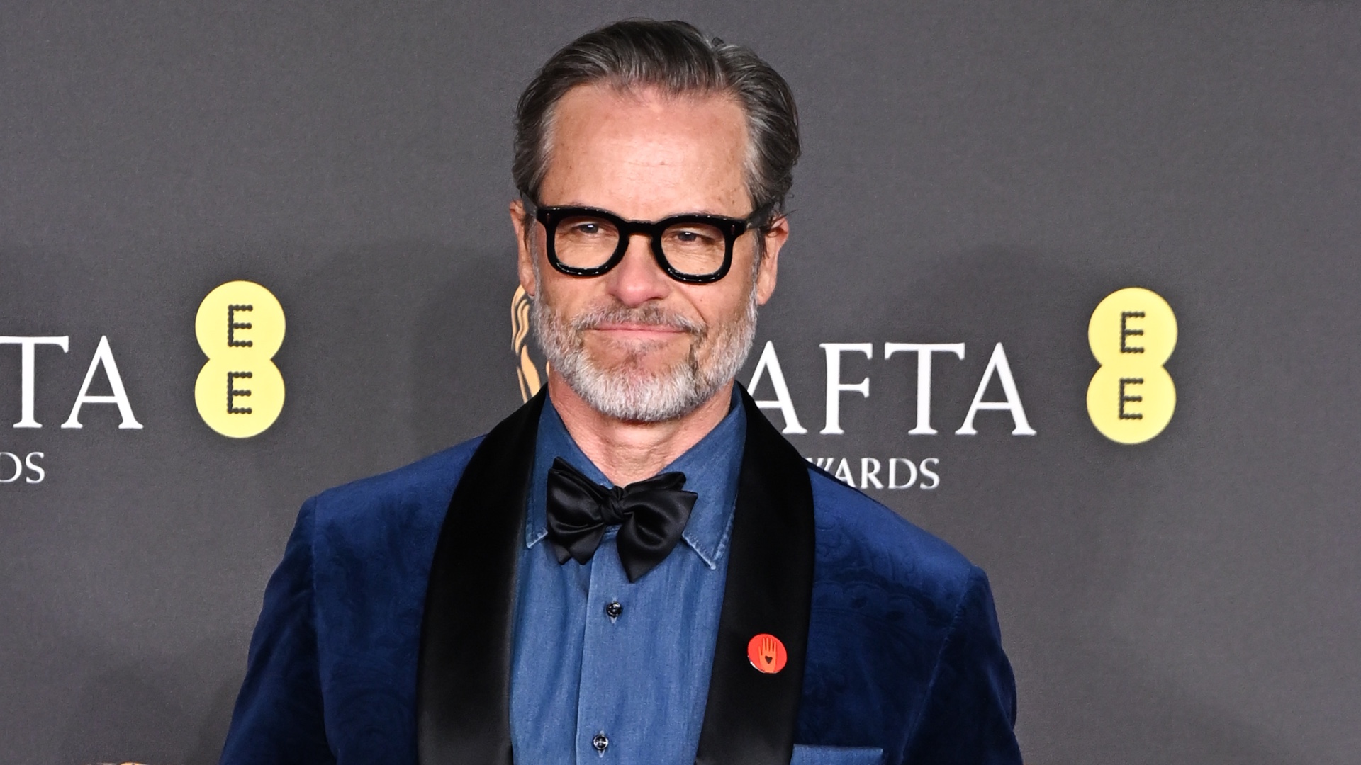 Guy Pearce attends the 2025 EE BAFTA Film Awards. CREDIT: Stephane Cardinale - Corbis via Getty Images.