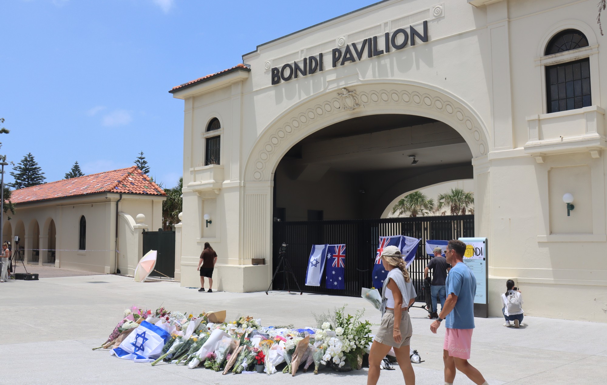 Locals arrive at the scene to mourn victims killed in a mass shooting on Australia's Bondi Beach on December 15, 2025. CREDIT: Bo Wenwen/China News Service/VCG via Getty Images