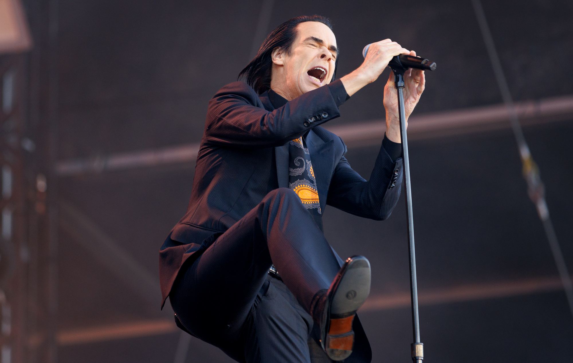 Nick Cave of Nick Cave & The Bad Seeds at Brighton's Preston Park, July 2026 (Photo by Alexander Cropper/Redferns)