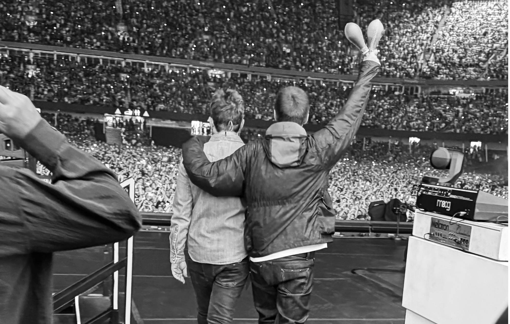 Noel and Liam Gallagher performing with Oasis at Cardiff Principality Stadium on Friday July 4, 2025. Credit: Angus Jenner