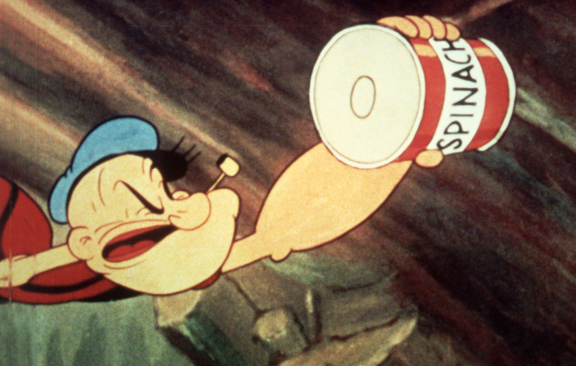 Popeye reaches for a can of spinach in a still from an unidenitified Popeye film, c. 1945.