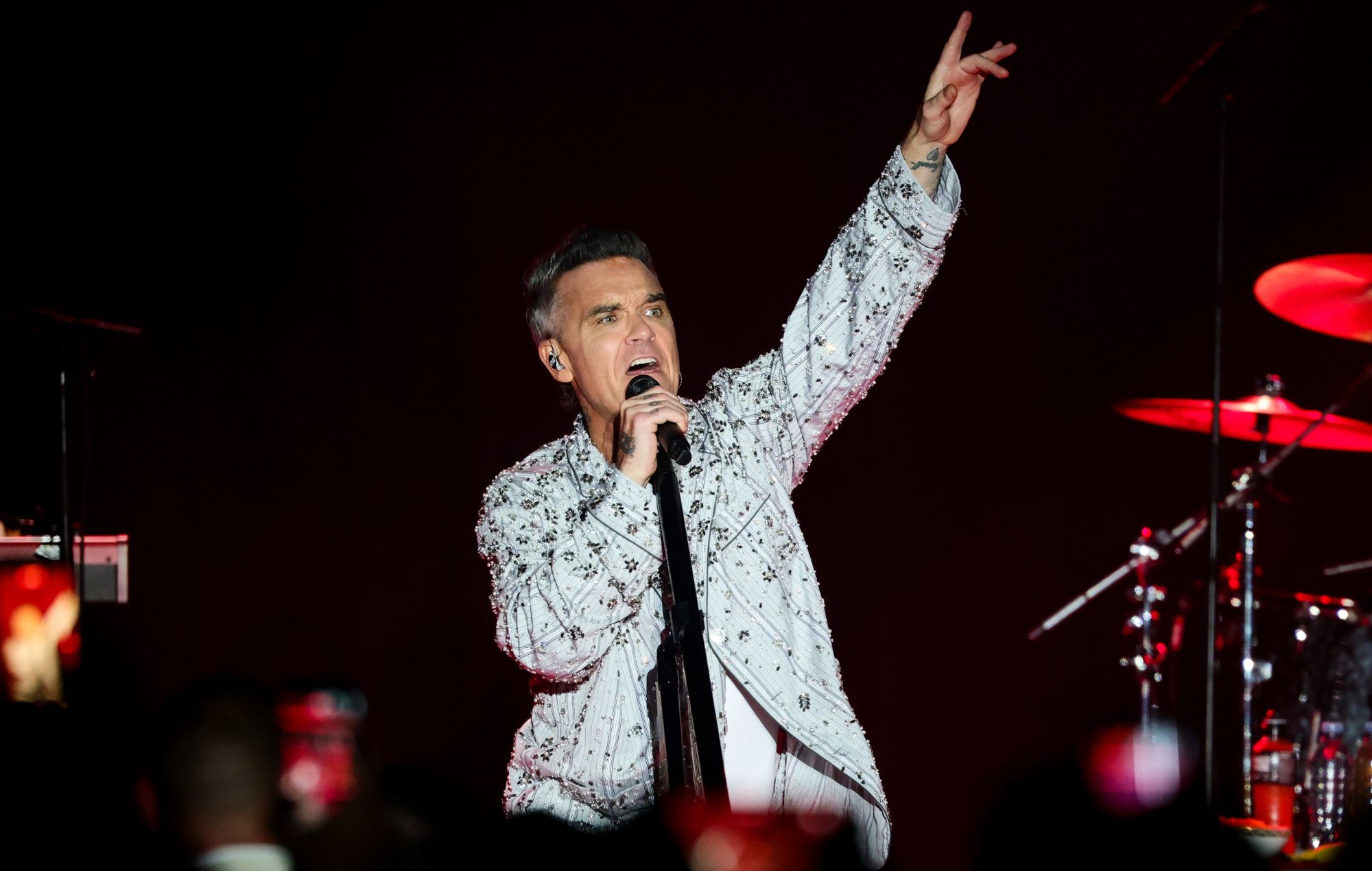 Robbie Williams performs in 2026