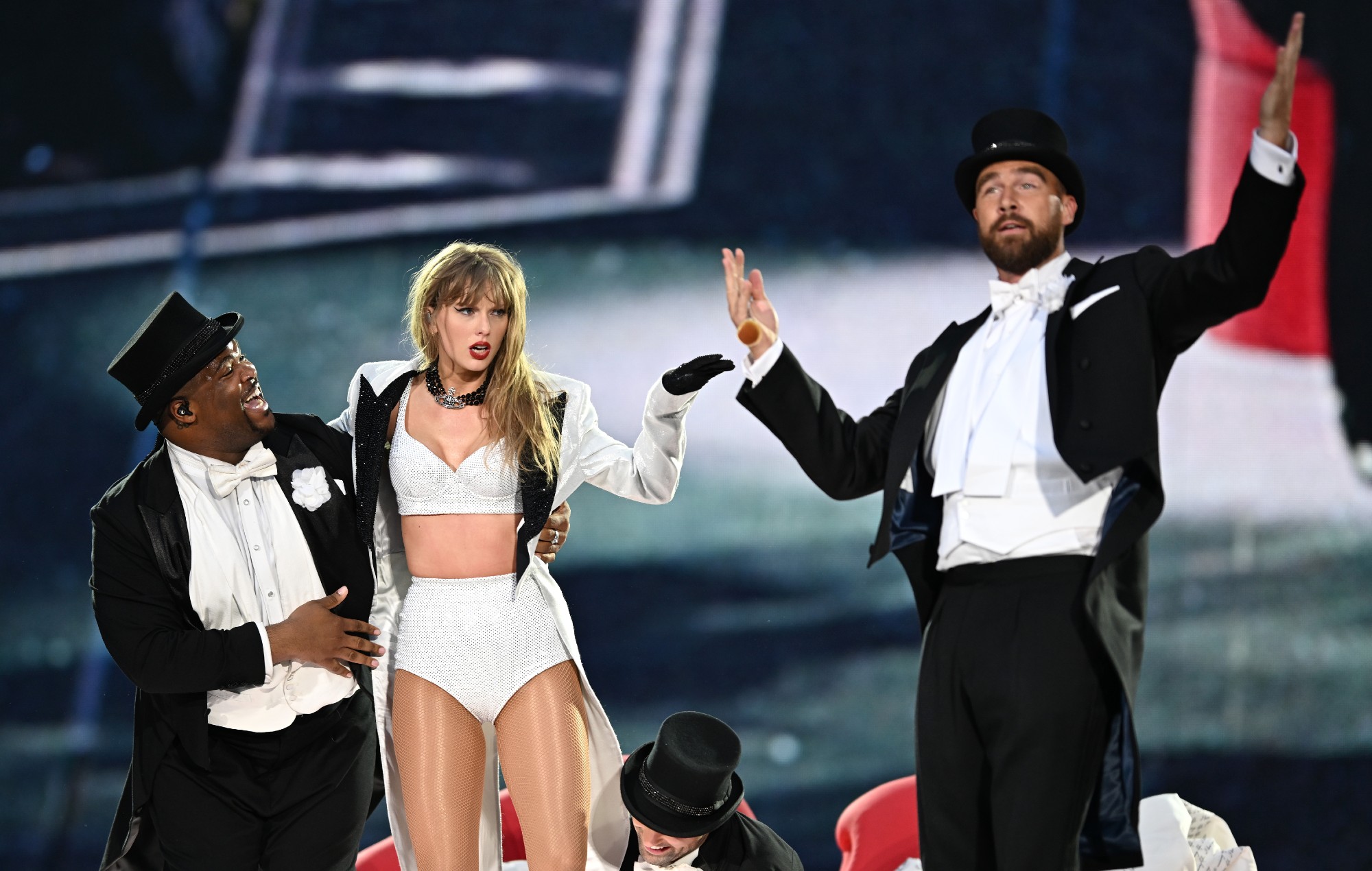 Taylor Swift is joined on stage by Travis Kelce (R), during "Taylor Swift | The Eras Tour" at Wembley Stadium on June 23, 2024 in London, England