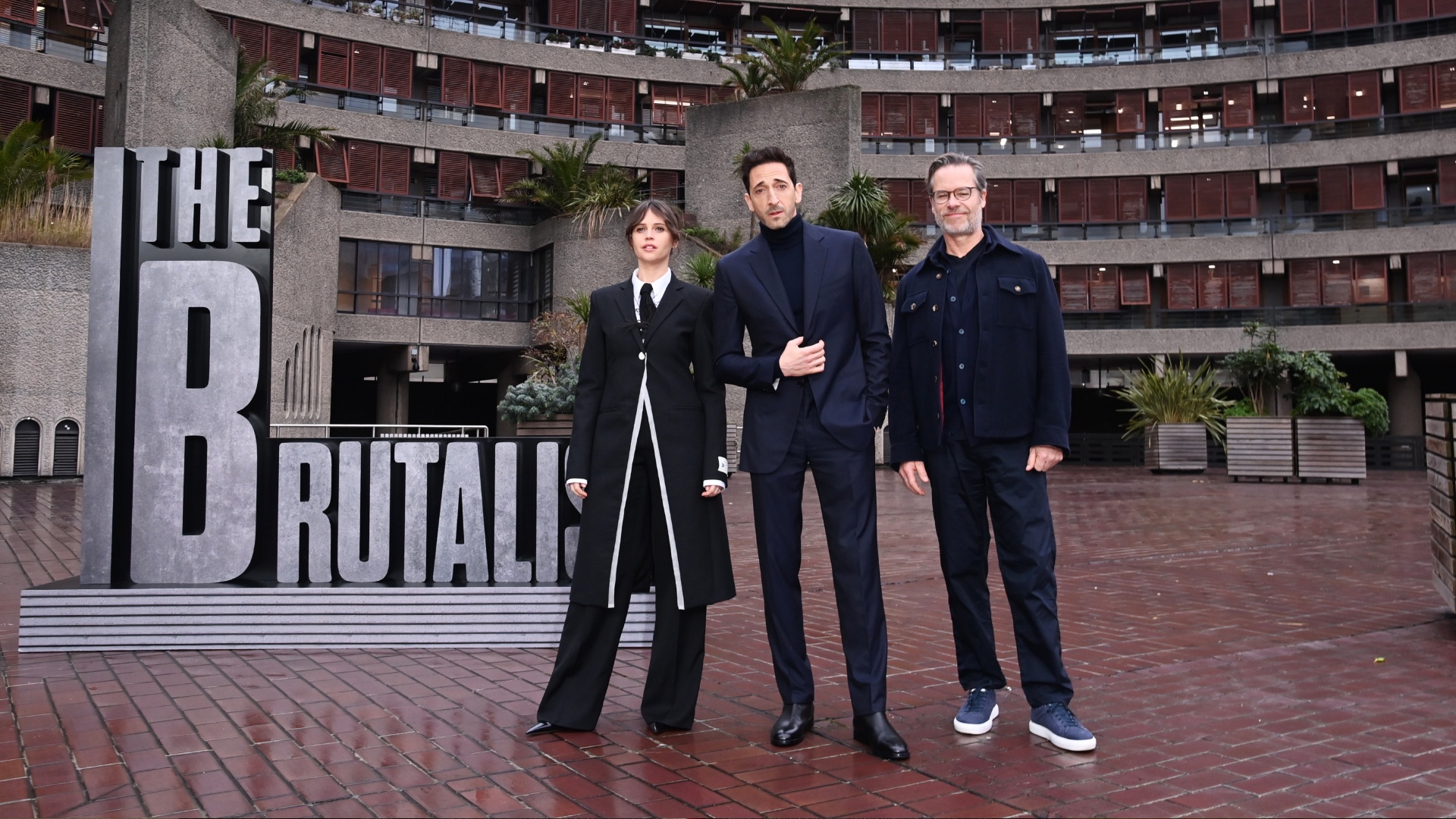 'The Brutalist' stars Felicity Jones, Adrien Brody and Guy Pearce attend a photocall at London's The Barbican. CREDIT: Alan Chapman/Dave Benett/WireImage via Getty Images
