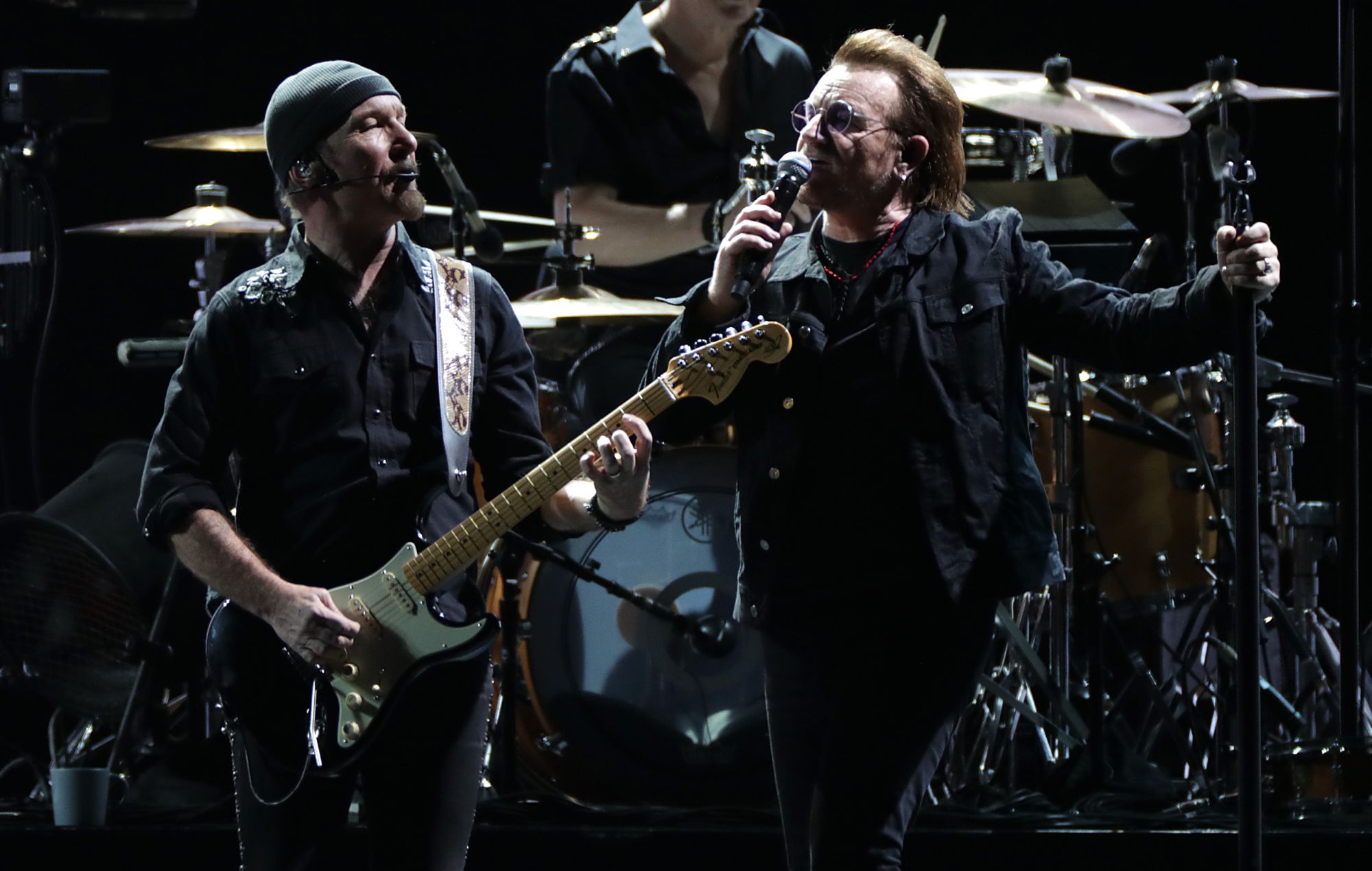 The Edge and Bono of U2 perform on stage