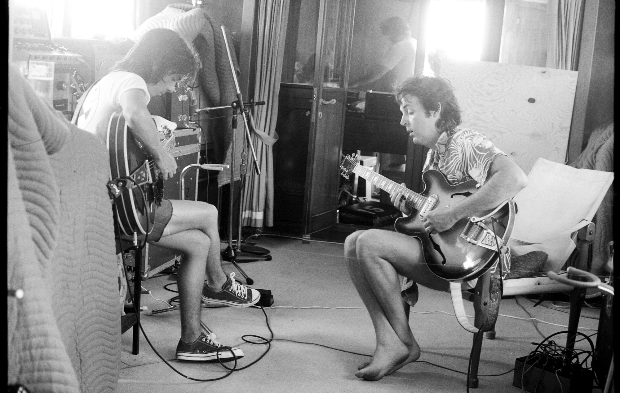 Jimmy McCulloch and Paul McCartney during the London Town recording sessions. Fair Carol yacht, Virgin Islands, 1977. Credit: © 1977 Paul McCartney under exclusive licence to MPL Archive LLP. Photographer: Linda McCartney